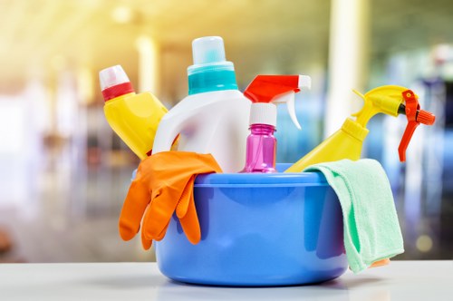 Commercial cleaners in Wimbledon vacuuming and maintaining an open-plan office