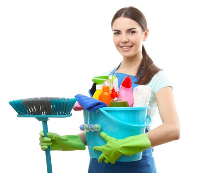 Professional cleaner maintaining a well-kept Wimbledon workspace