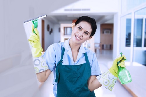 Professional Wimbledon office cleaning team sanitising shared workplace surfaces